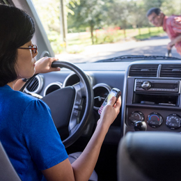 Woman Driving And Texting