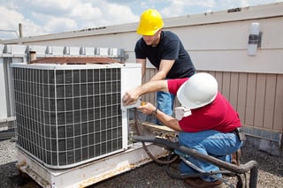 bigstock-Two-workers-on-the-roof-of-a-b-11990135.jpg