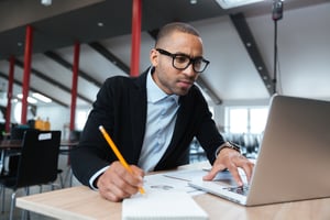 young African American businessman on laptop