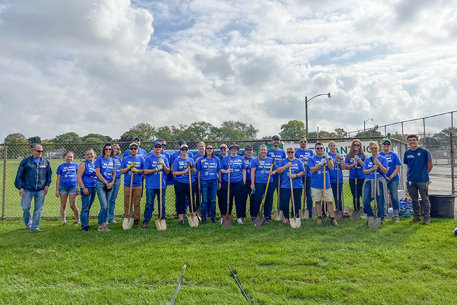 West Bend associates and agency partners at tree planting event.