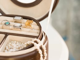 Different pieces of jewelry inside a jewelry case.