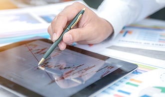 accountant looks at graph on their iPad
