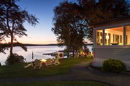 house by lake at twilight
