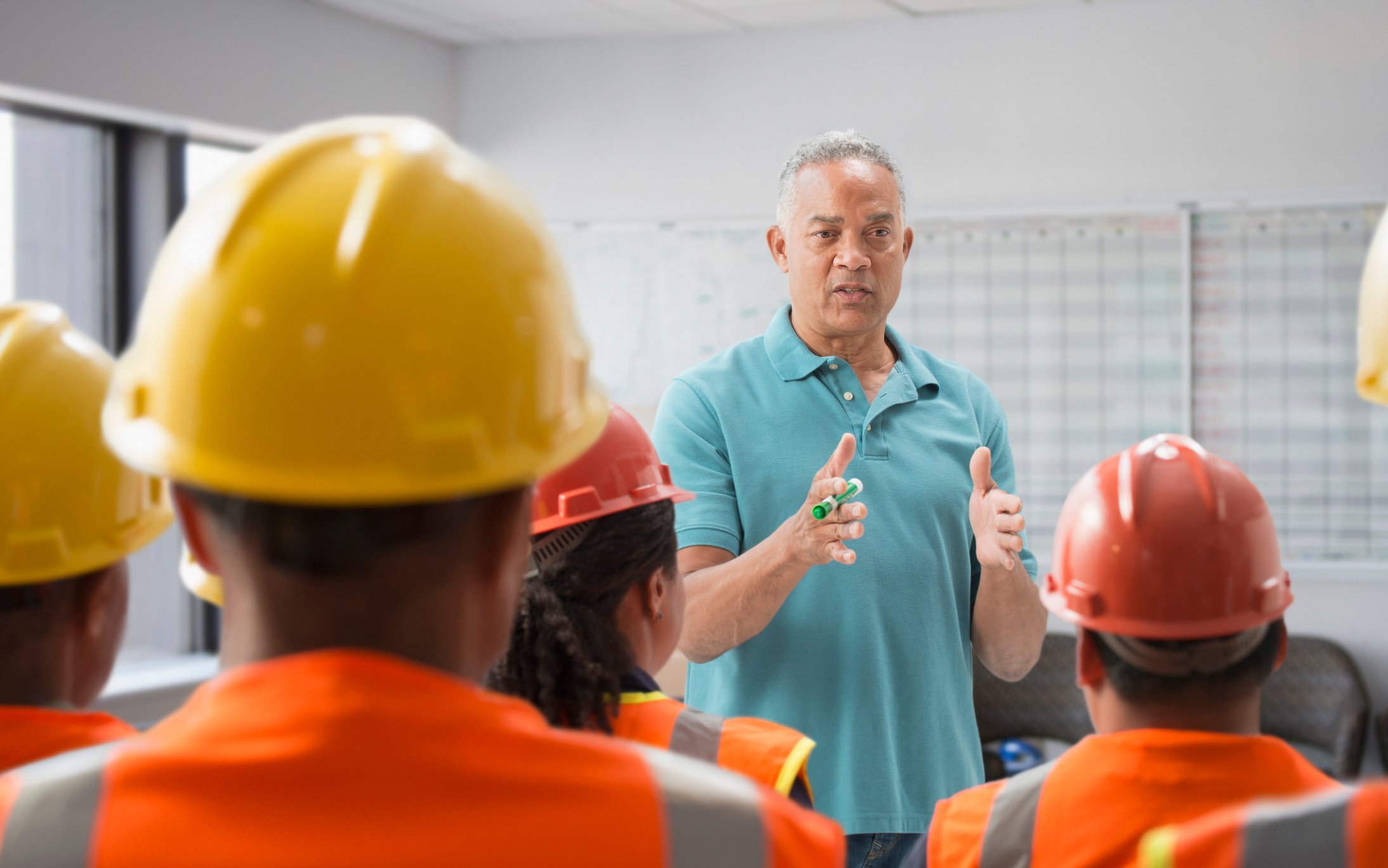 construction employees at safety meeting