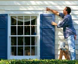 man-painting-house