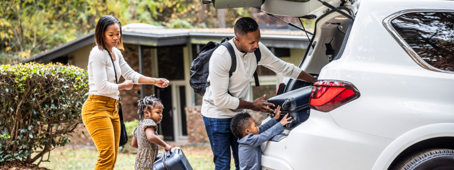 A family packing up their car for vacation