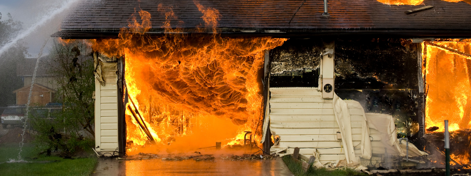 A home with a garage on fire
