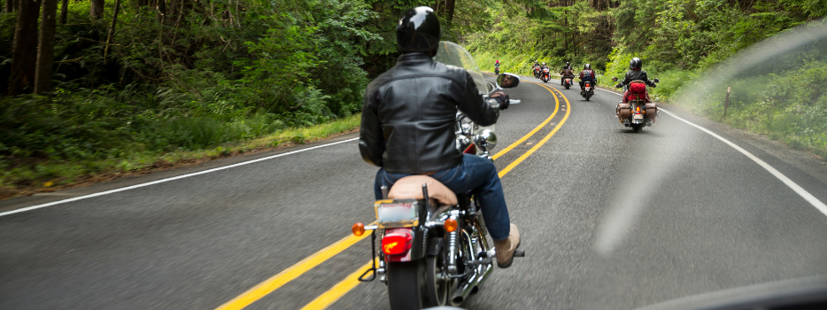 A group of motorcycle riders on a highway